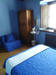 A bed or beds in a room at Hospedaje - Ferrería Quintá