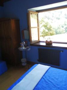 A bed or beds in a room at Hospedaje - Ferrería Quintá