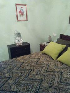 A bed or beds in a room at Hospedaje - Ferrería Quintá