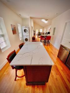 a living room with a table with a map on it at Perrin Place Unit 3 in Boston