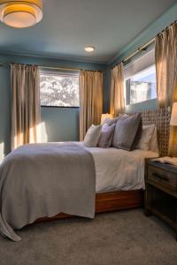 a bedroom with a large bed and a window at Aspects Big Sky in Big Sky +50 photos
