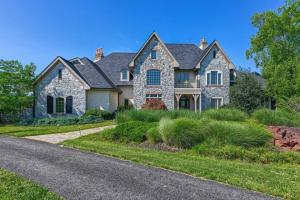 a home with a stone house with a driveway at Manor on the 7th in Gettysburg