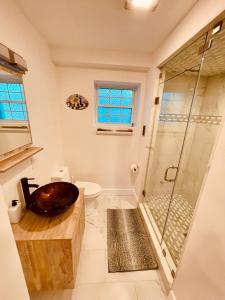 a bathroom with a sink and a shower at Perrin Place Unit 3 in Boston