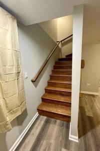 a staircase in a home with wooden floors at SPACIOUS & MODERN 3 BR HOME WI-Fi FREE PARKING in Chicago