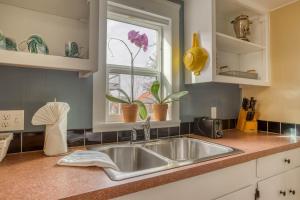 a kitchen with a sink and a window at The Turtle's Nest in Waldport