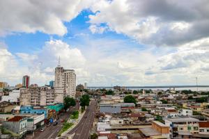 a view of a city with buildings and a street at Apto no Centro de Manaus com vista para o Rio Negro in Manaus