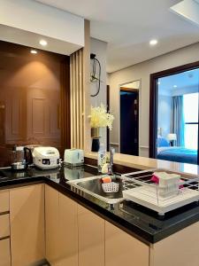 a kitchen with a sink and a counter top at Luxury 2Bedroom Apartment with Ocean view 25th Floor in Da Nang