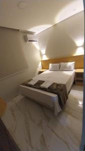מיטה או מיטות בחדר ב-Hotel New Space