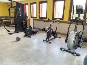 a gym with several exercise bikes in a room at Appartement Risoul, 2 pièces, 4 personnes - FR-1-330-569 in Risoul