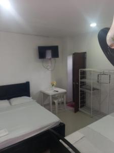 Łóżko lub łóżka w pokoju w obiekcie Apartahotel Mar Azul