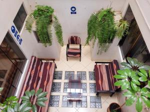 an overhead view of a lobby with chairs and potted plants at Illari Wari l - Hotel Sauna in Ayacucho