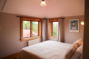 Postel nebo postele na pokoji v ubytování Te Anau Lodge
