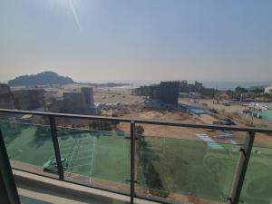 a view of a tennis court from a balcony at Hotel Oceanview in Incheon