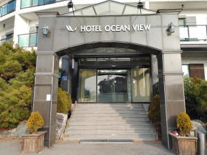 a entrance to a hotel with stairs leading into it at Hotel Oceanview in Incheon