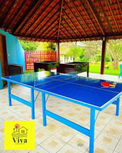a blue ping pong table on a patio at Apto GRAVATÁ ASA BRANCA D12 04 in Gravatá +14 photos