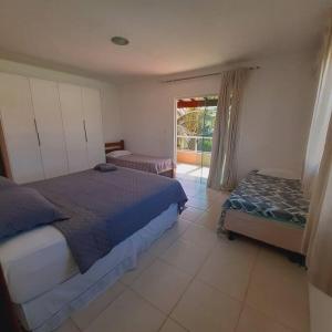 Voodi või voodid majutusasutuse Barra de Jacuípe - Condomínio Parque Jacuipe toas +40 fotot