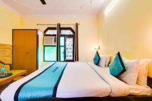 Krevet ili kreveti u jedinici u objektu Swiss Cottage by Oscenox , Rishikesh