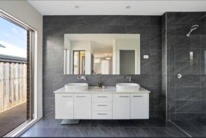 a bathroom with two sinks and a mirror at Luxury House Boho Seaside in Cowes +41 photos
