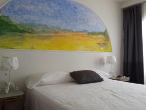 A bed or beds in a room at Hotel Nautilus