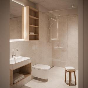 卡羅利嫩西爾的住宿－NOORD Carolinensiel，浴室配有卫生间、盥洗盆和淋浴。