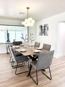 a dining room with a wooden table and chairs at Newly remodeled beauty in Phoenix in Phoenix