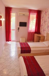 Postel nebo postele na pokoji v ubytování Rilena Hotel