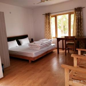 Postel nebo postele na pokoji v ubytování Hotel Samyas