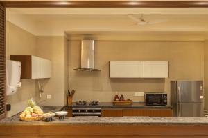 a kitchen with a counter with fruit on it at Aalia Villas Anjuna, Goa by Aalia Collection in Anjuna