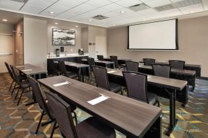 a classroom with tables and chairs and a white screen at Residence Inn By Marriott Wichita Falls in Wichita Falls