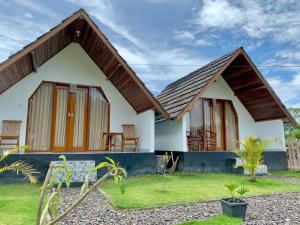 a small house with a pitched roof at Serene Wilderness Villa Near Batur Natural Hot Spring in Kintamani