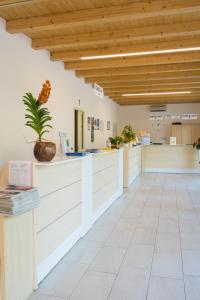 a lobby of a hospital with a reception counter at Campeggio Gasparina in Castelnuovo del Garda