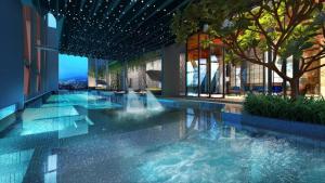 una piscina con acqua in un edificio di Scarletz Suites KLCC Deluxe Studio Room Single Double Bed a Kuala Lumpur
