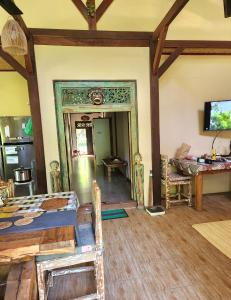 a room with a bed and a mirror in it at Rumah Atlas in Senggigi 