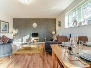 a living room with a couch and a table at Fox Acre - Uk46236 in Usk