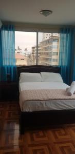 Postel nebo postele na pokoji v ubytování Hostal Costa Linda Salinas + 8 fotografií