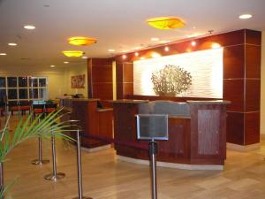 a lobby with a large screen on the wall at La Cabana BRC Studio & Apartment in Palm-Eagle Beach