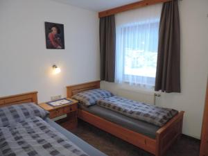 A bed or beds in a room at Apartment in Ischgl overlooking the mountains Még 18 kép