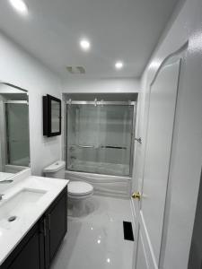 a bathroom with a shower and a toilet and a sink at Private room in a House in Mississauga