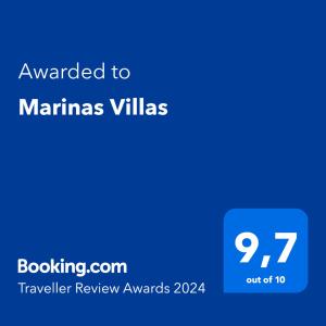 a blue screen with the text awarded to marinus villas at Marinas Villas in Amoudara Herakliou