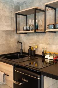 a kitchen with a sink and a counter top at The Sound of Silence - romantic tiny house near Riga in Salaspils