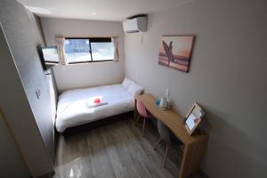 最高の夏にするための特別割引 海外のようなロケーションのコンテナ型ホテル客房内的一张或多张床位