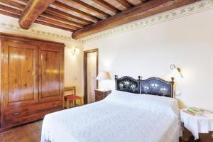 Postel nebo postele na pokoji v ubytování Agriturismo I Fuochi