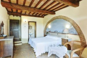Postel nebo postele na pokoji v ubytování Agriturismo I Fuochi