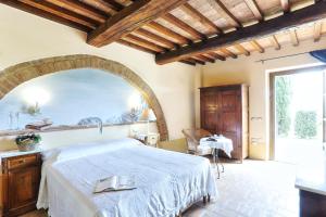 Postel nebo postele na pokoji v ubytování Agriturismo I Fuochi