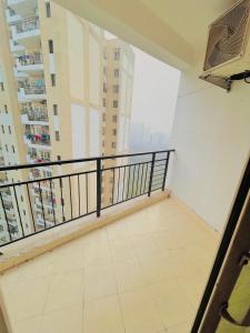 a balcony with a view of a city at THE HONEY HOMES in Noida