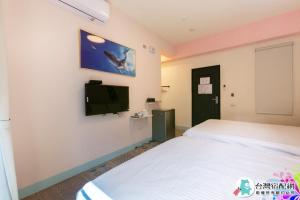 Uma cama ou camas num quarto em Baby Dolphin
