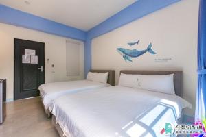 Uma cama ou camas num quarto em Baby Dolphin