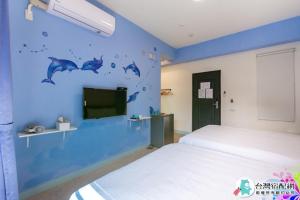 Uma cama ou camas num quarto em Baby Dolphin