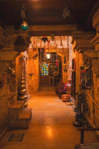 a hallway of a building with a door and lights at Hotel Victoria in Jaisalmer