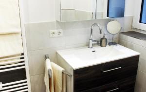 a bathroom with a sink and a mirror at Haus Hildegard in Zwiesel